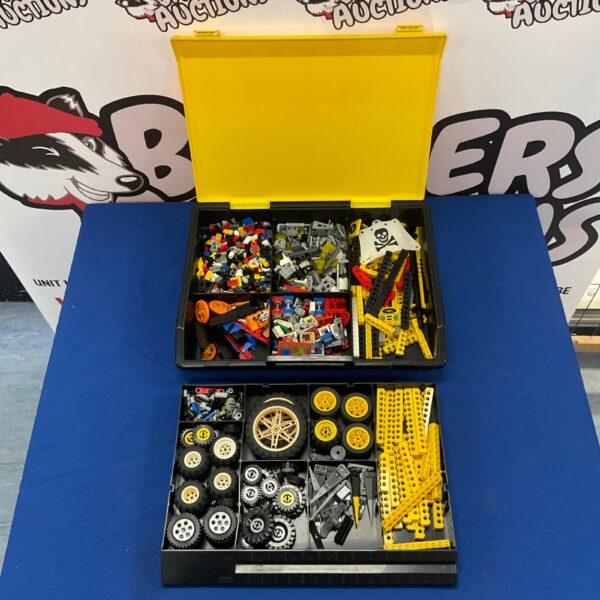 Lego Technic parts lot in a clear storage box.