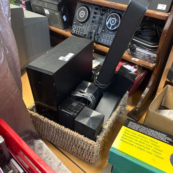 LG sound system with subwoofer and soundbar for home cinema.