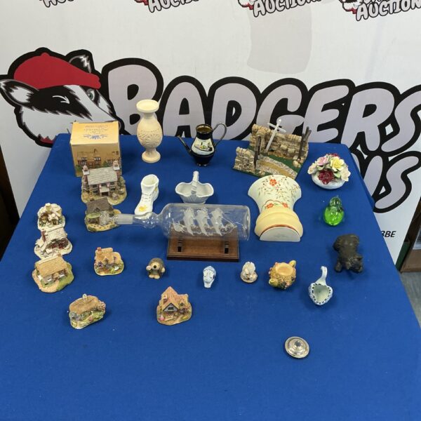 Collection of Lilliput Lane cottages and collectible ornaments and figurines.