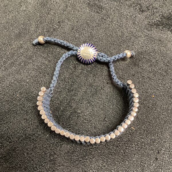 Close-up of Links London silver beaded bracelet with lobster clasp.