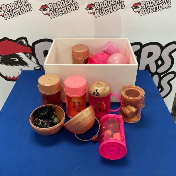 LOL Surprise toy lot with figures and accessories in a clear container.