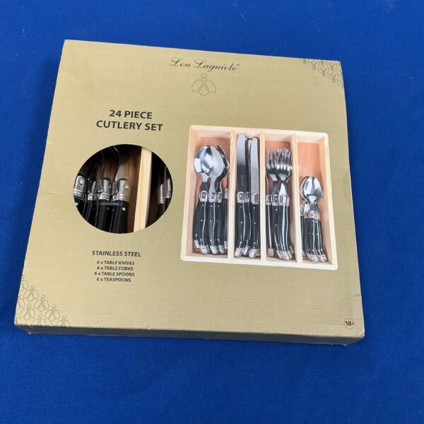 Lou Laguiole 24 piece cutlery set displayed on a table.