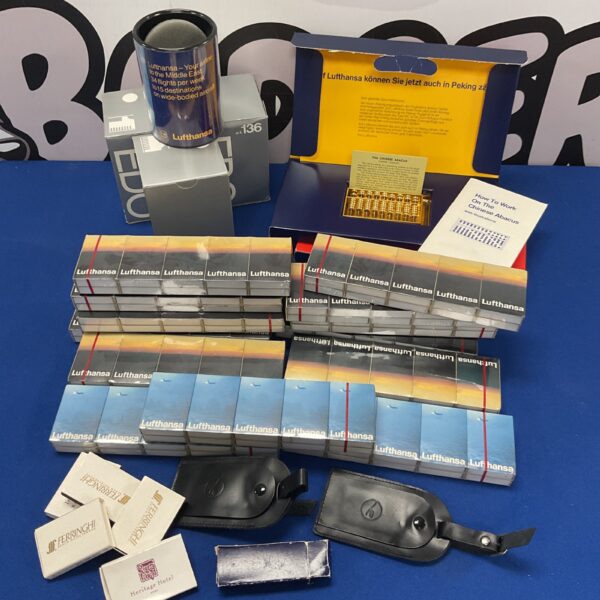 Vintage Lufthansa airline memorabilia lot with matchboxes and abacus.