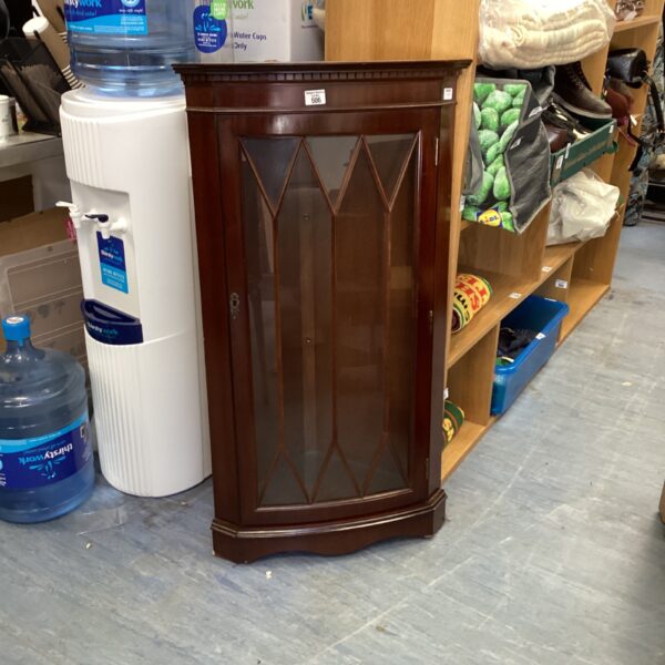 Antique mahogany corner cabinet with astral glazed door.