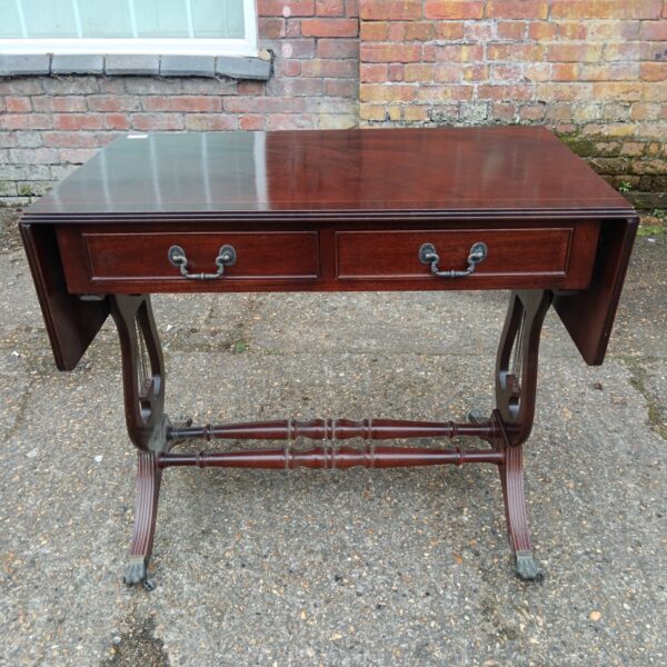 Antique mahogany drop leaf table with claw feet, elegant hall console.