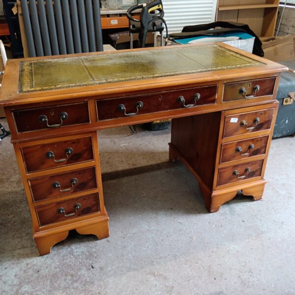 Handsome mahogany executive desk with leather top.