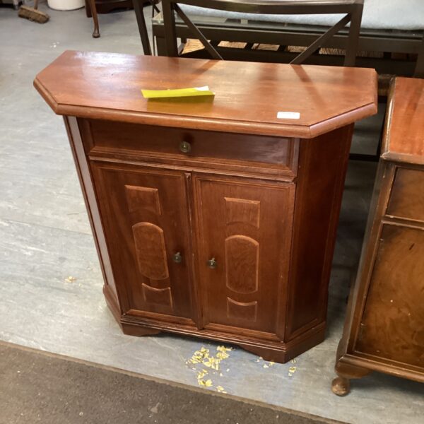 Vintage mahogany side cabinet with single drawer for storage.