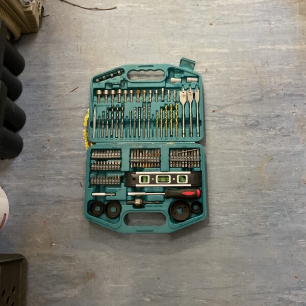 Makita 101-piece drill bit set in open case, showing various bits.