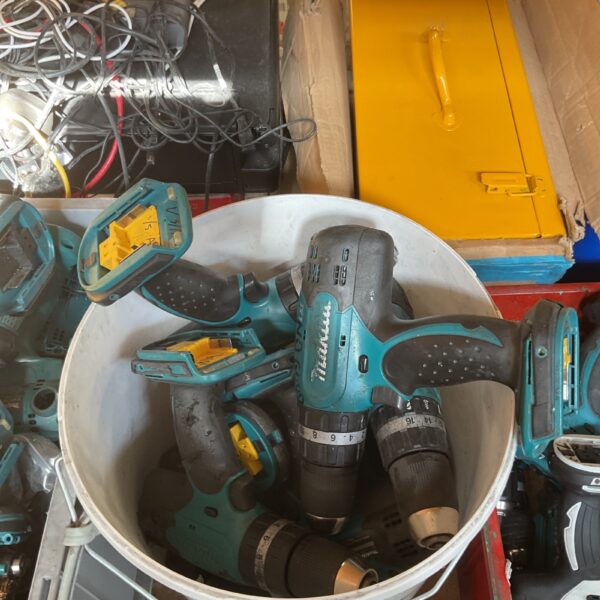 Used Makita 18V LXT cordless drill in a workshop setting.