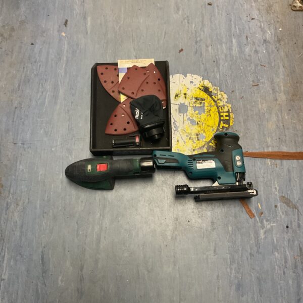 Makita cordless multi-tool set with Bosch sander and attachments.