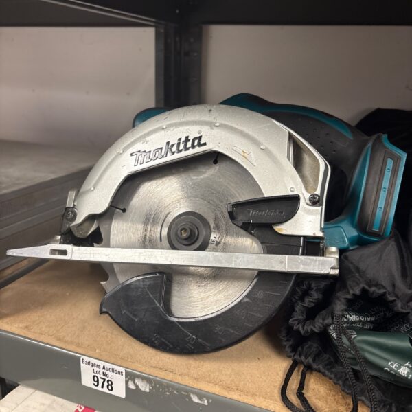 Close-up of Makita circular saw blade and housing.
