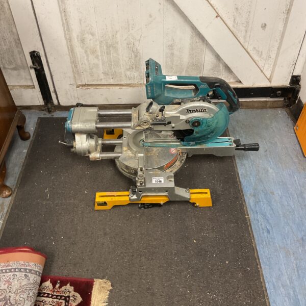Used Makita sliding compound mitre saw for woodworking projects.