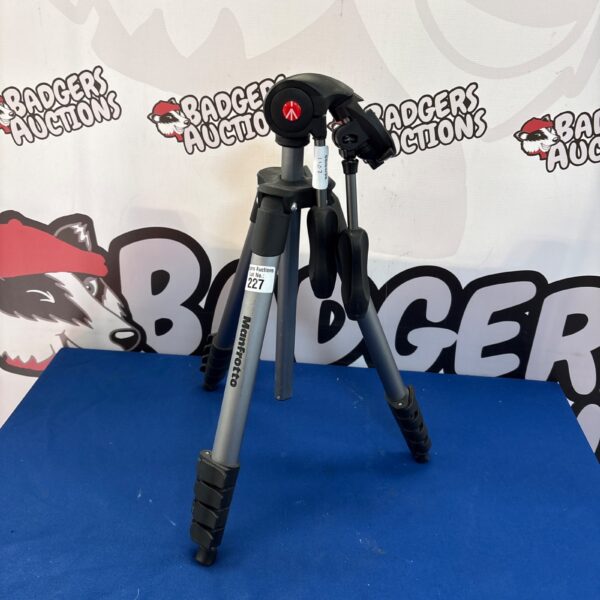 Silver Manfrotto tripod for camera stability and photography.