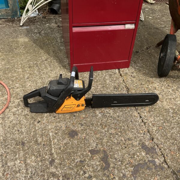 Vintage McCullough petrol chainsaw in used condition.