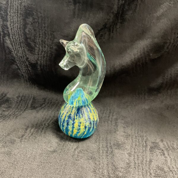 Vintage Mdina glass seahorse paperweight with blue and yellow swirls.