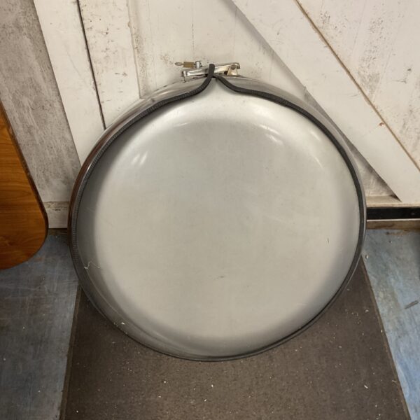 Silver Mercedes G Class wheel cover showing wear.