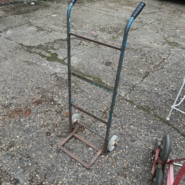 Small metal hand trolley for moving boxes and sacks.