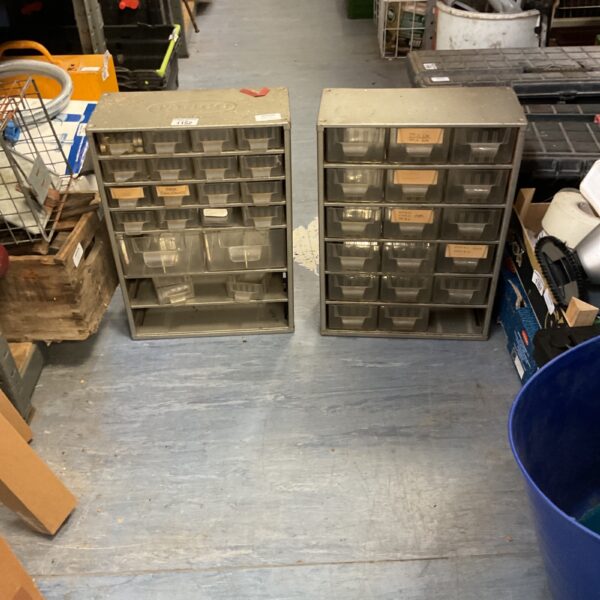 Metal small parts organiser with multiple drawers for workshop storage.