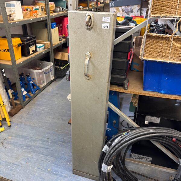 Vintage metal strongbox with key lock and carrying handle.