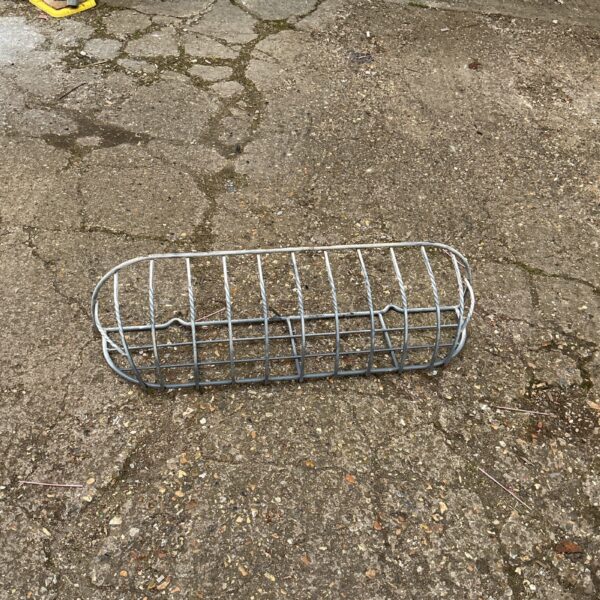 Vintage metal wall basket for plants and garden decor.