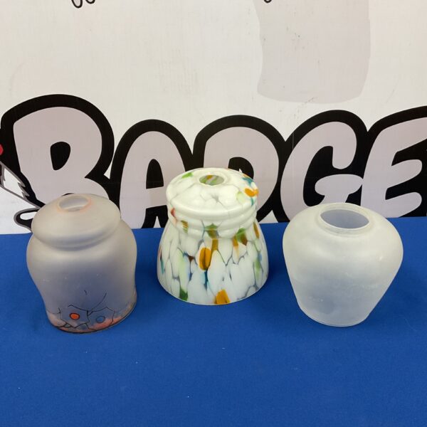 Vintage mid-century modern glass lamp shades with amber and white swirls.