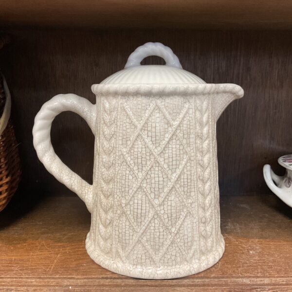 Vintage mid-century porcelain teapot with rope pattern detailing.