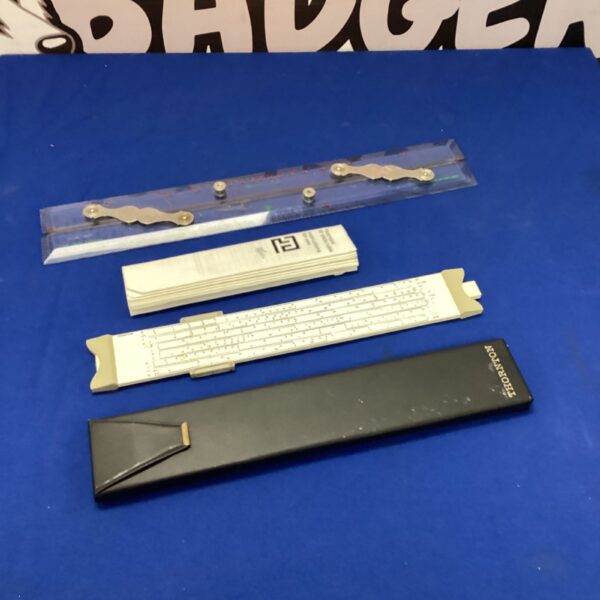 Vintage military map plotting tools and Thornton slide rule.