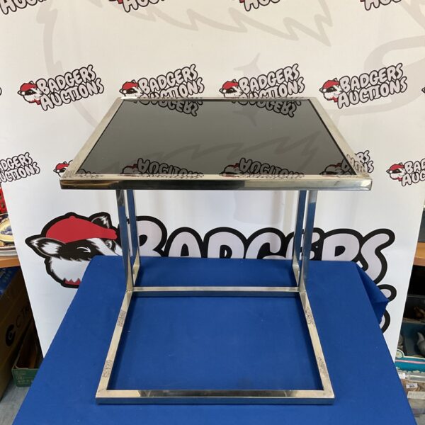 Vintage Milo Baughman table with black glass top and chrome frame.