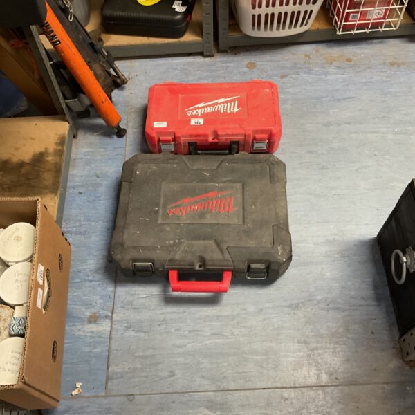 Two red Milwaukee tool cases for power tool storage.