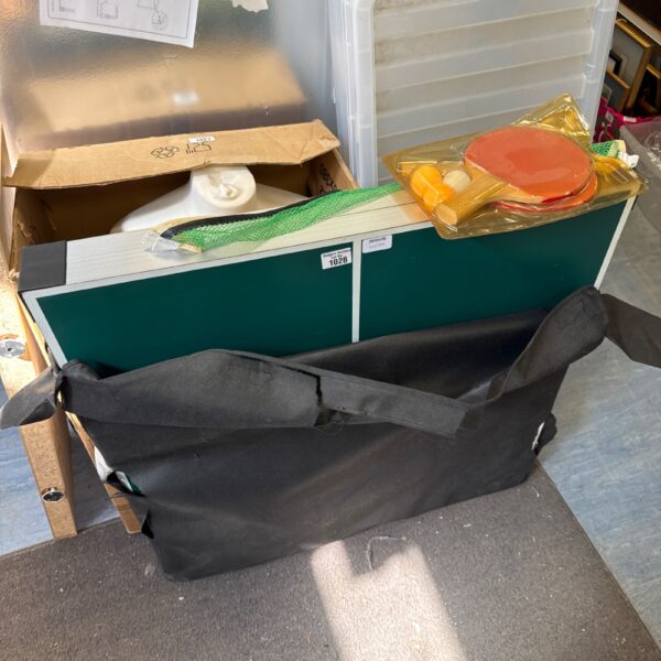 Compact folding table tennis table with accessories for portable play.