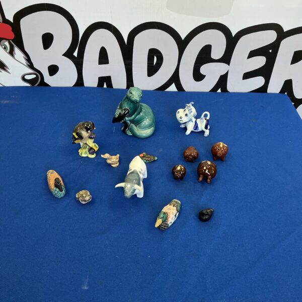Collection of miniature porcelain animals including Poole pottery figurines.