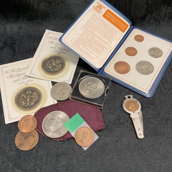 Mixed British coin collection featuring commemorative crowns and decimal coins.