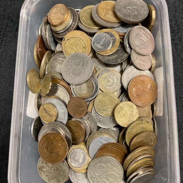 Mixed coin lot in a clear tub, UK currency collection.
