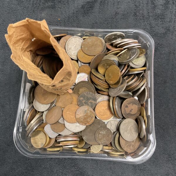 Mixed coin lot in a clear tub, UK and world currency.