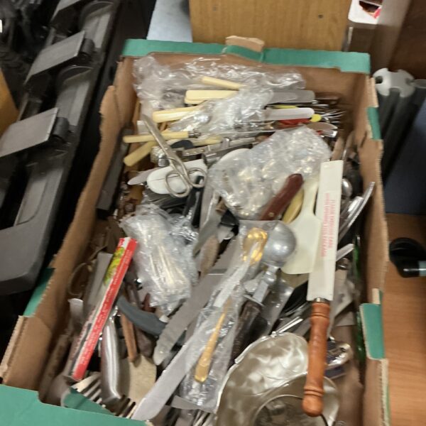 Assorted mixed cutlery lot with stainless steel forks and knives.