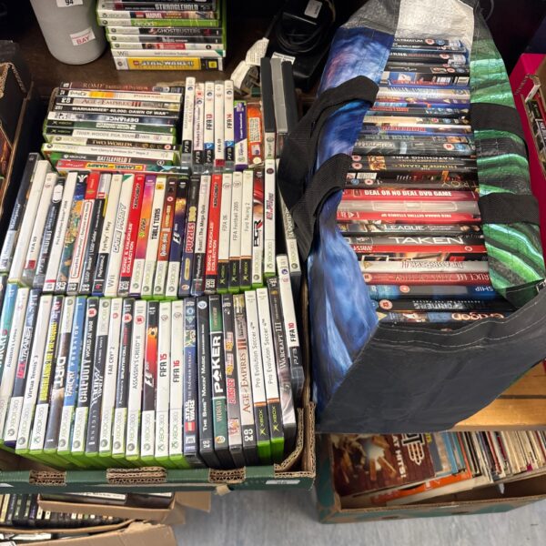 Mixed lot of video games and DVD movies for various consoles.