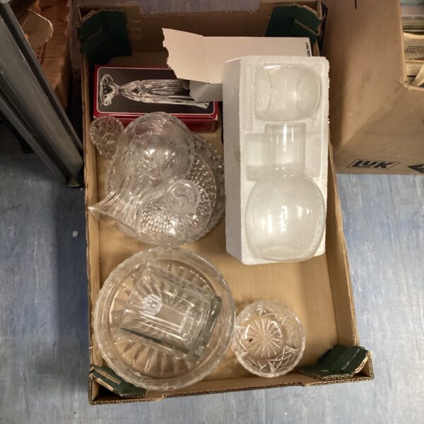 Mixed glassware lot including a decanter and tumblers on display.