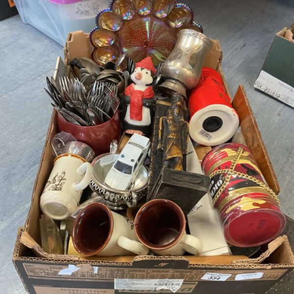 Mixed lot of vintage mugs and ceramic collectibles on display.