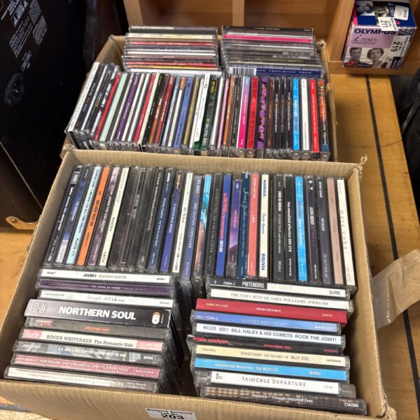 Large lot of mixed music CDs and albums for collectors.
