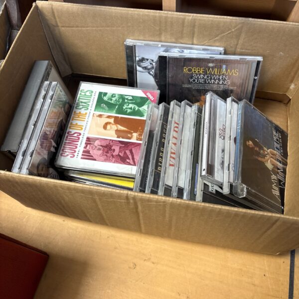 Mixed music CD lot with various album covers.