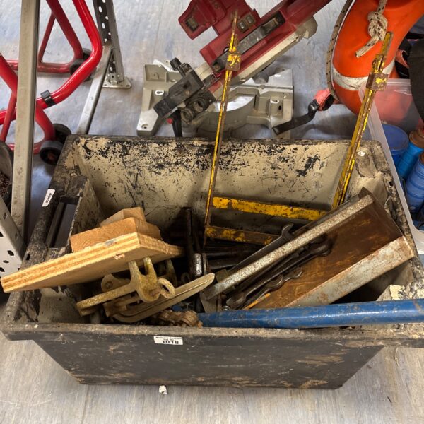 Mixed tool lot including spanners and nails for DIY projects.