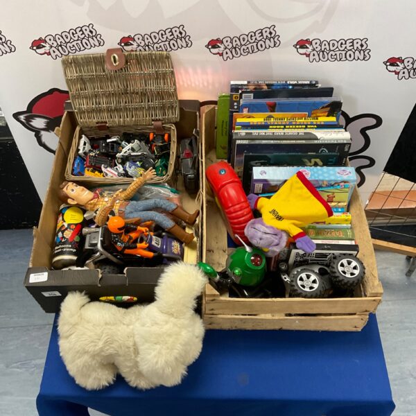 Mixed toy and book lot featuring Toy Story Woody and diecast cars.