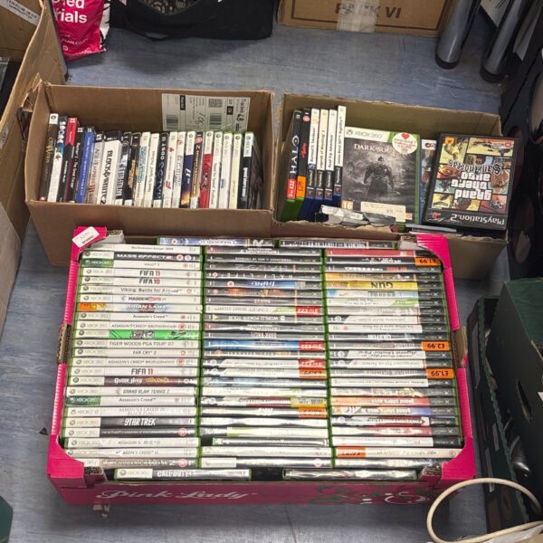 Mixed lot of Xbox and PlayStation video games for collectors.