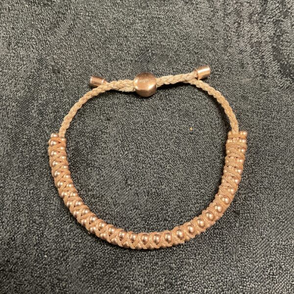 Close-up of Monica Vinader silver bracelet with beaded detail.