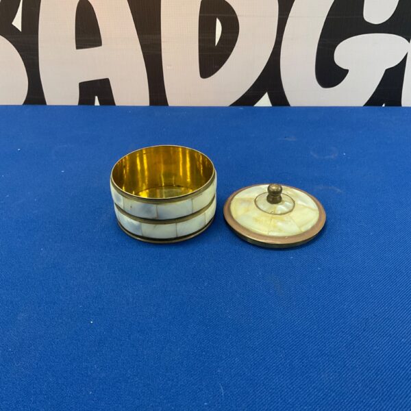 Vintage mother of pearl trinket pot with brass base.