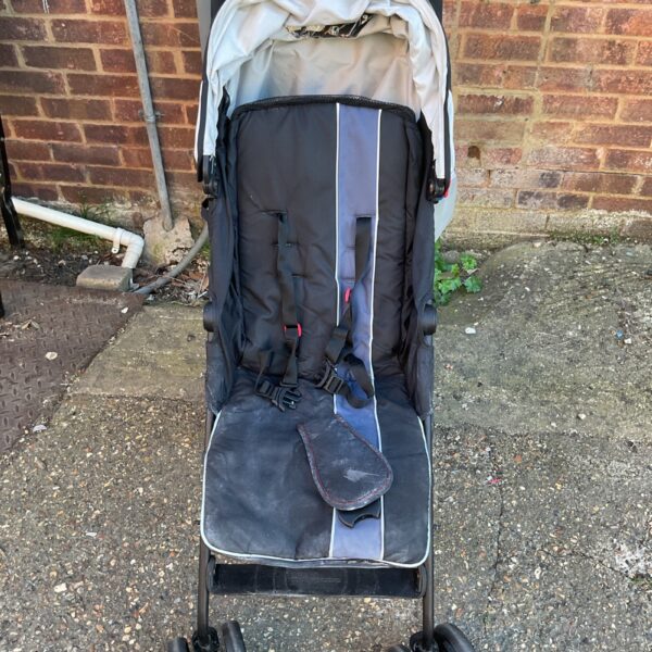 Mothercare roll baby pram showing signs of wear.