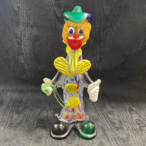 Vibrant Murano glass clown figurine with colourful harlequin costume.