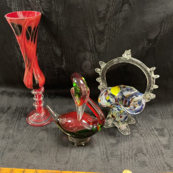 Vibrant red Murano glass vase with swirling patterns.