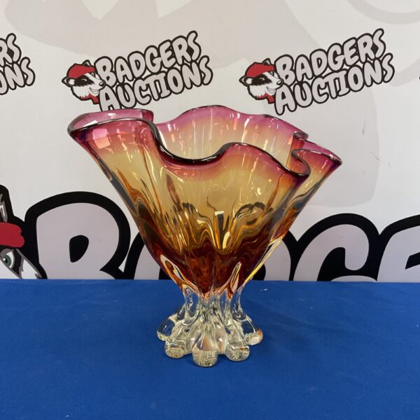 Vibrant pink and orange Murano glass vase with sculptural base.