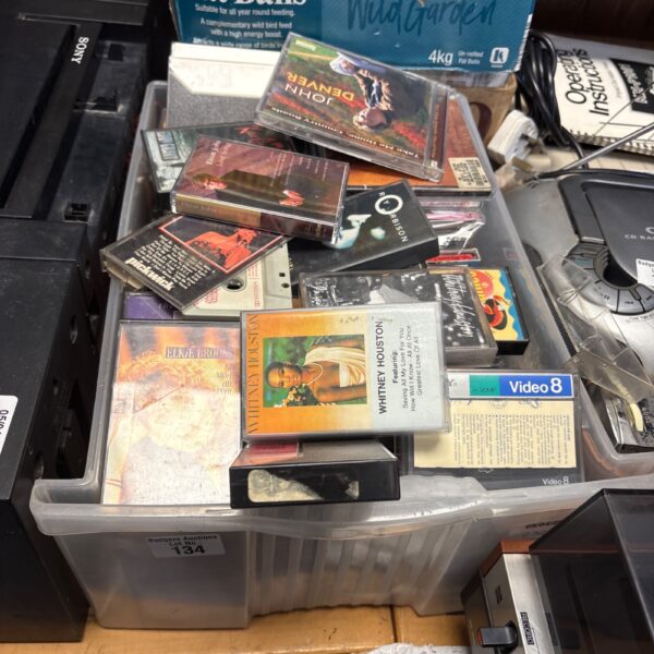 Music CD and cassette tape lot with Whitney Houston visible.